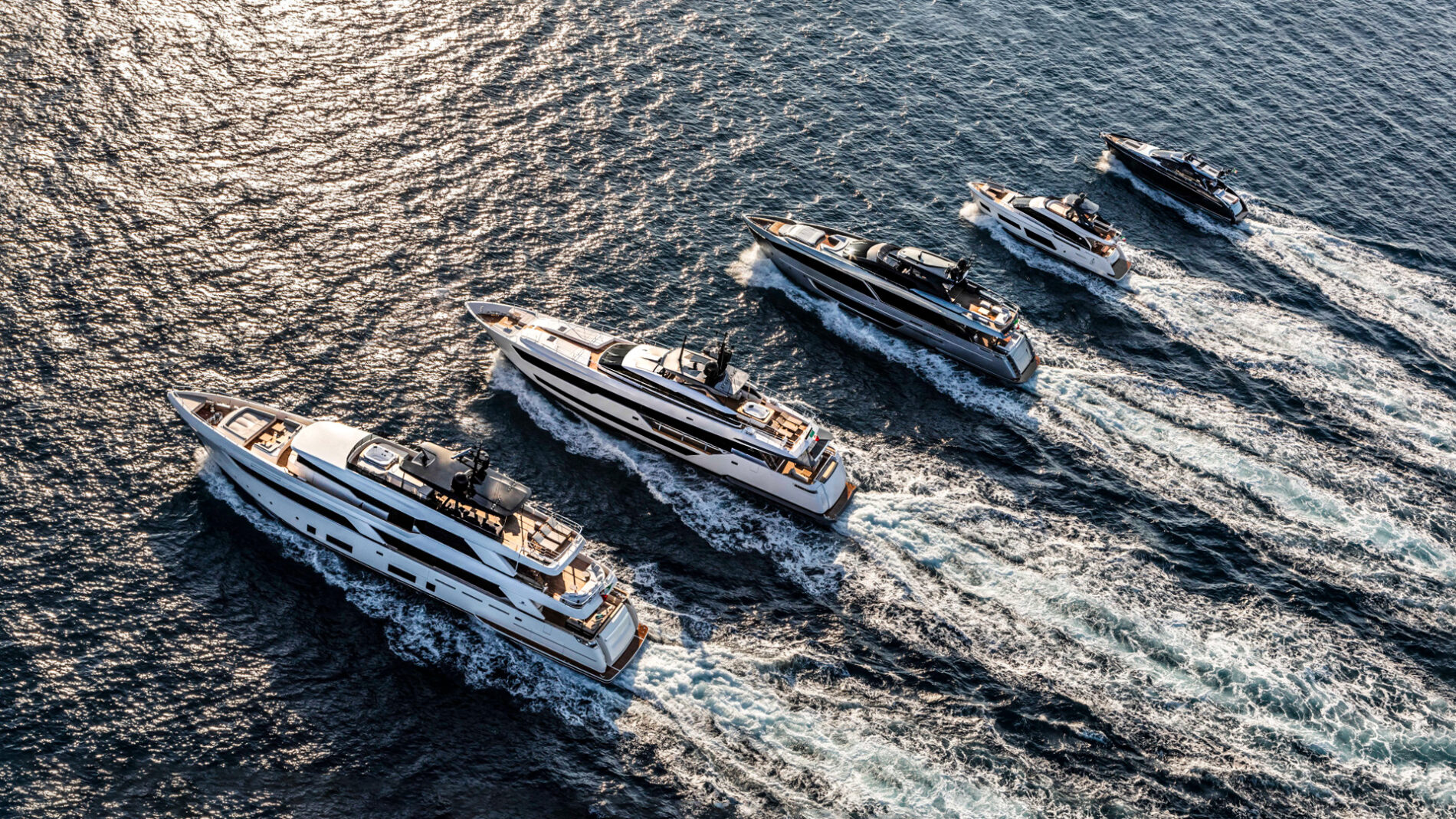 riva-yacht-fleet-running-on-sea